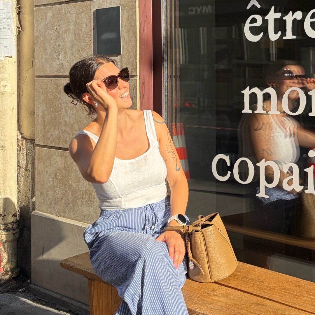 Natalie Sini sitting outside in the sunshine